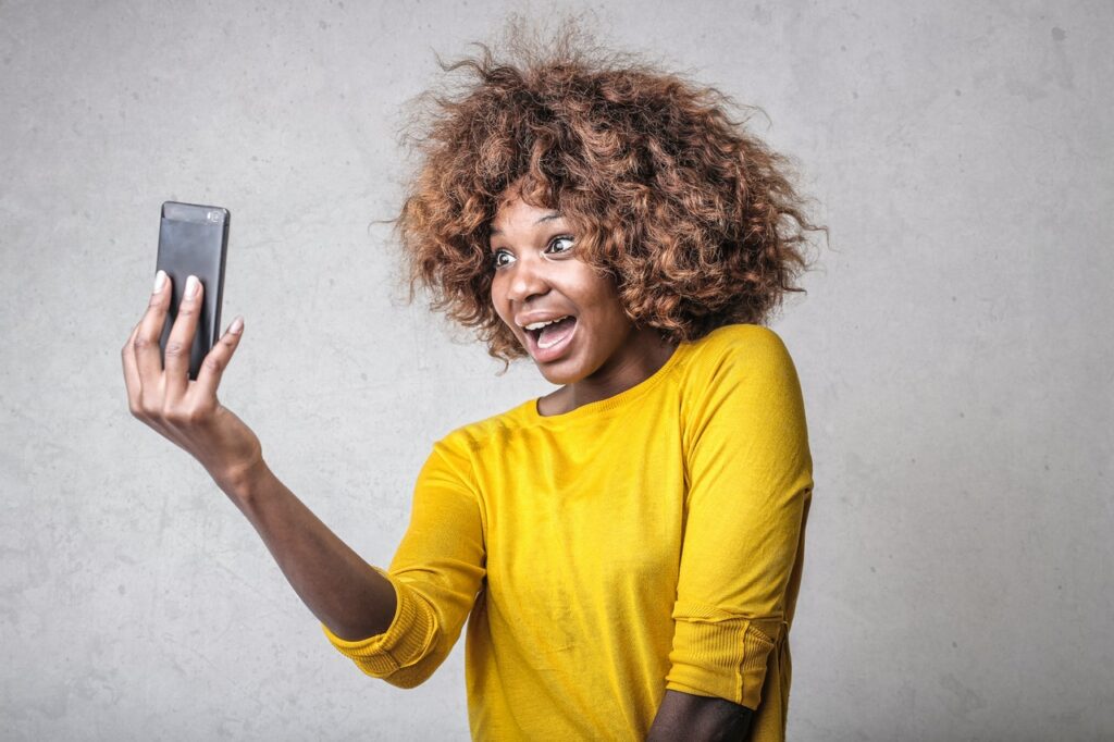 Woman recording a video to introduce herself