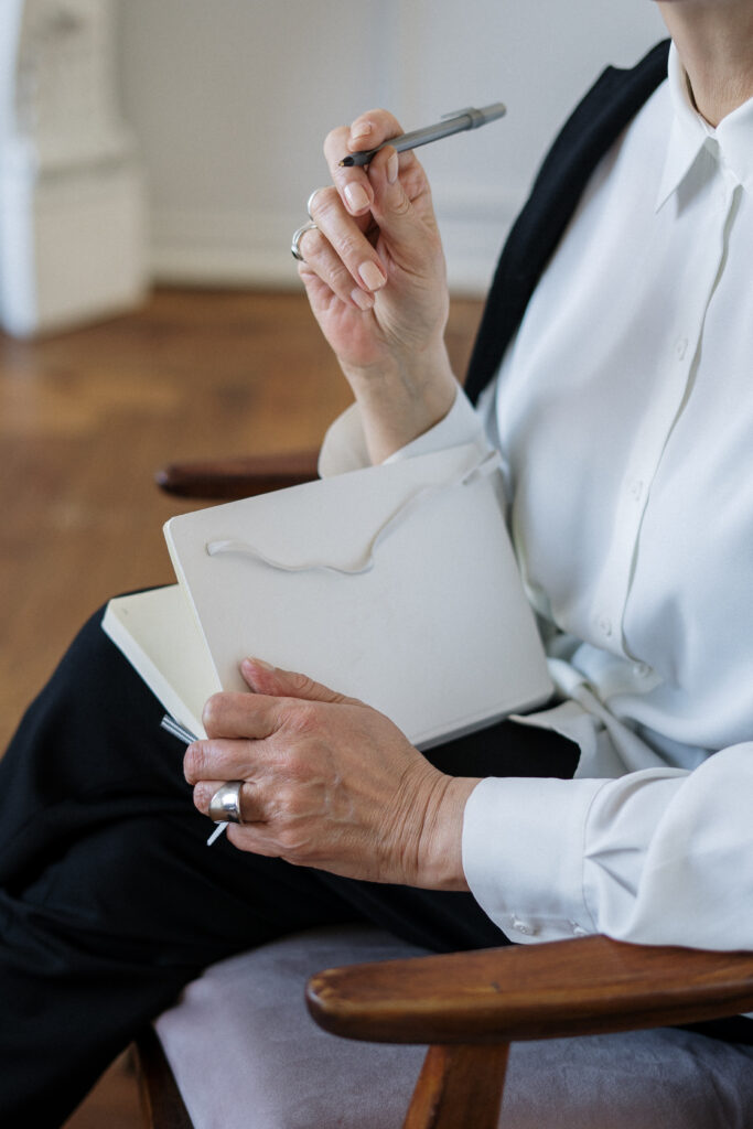 Woman taking notes in notebook