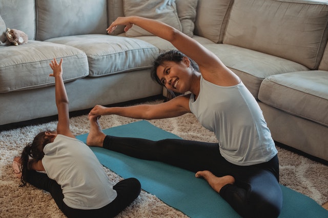 Mother and daughter practicing yog