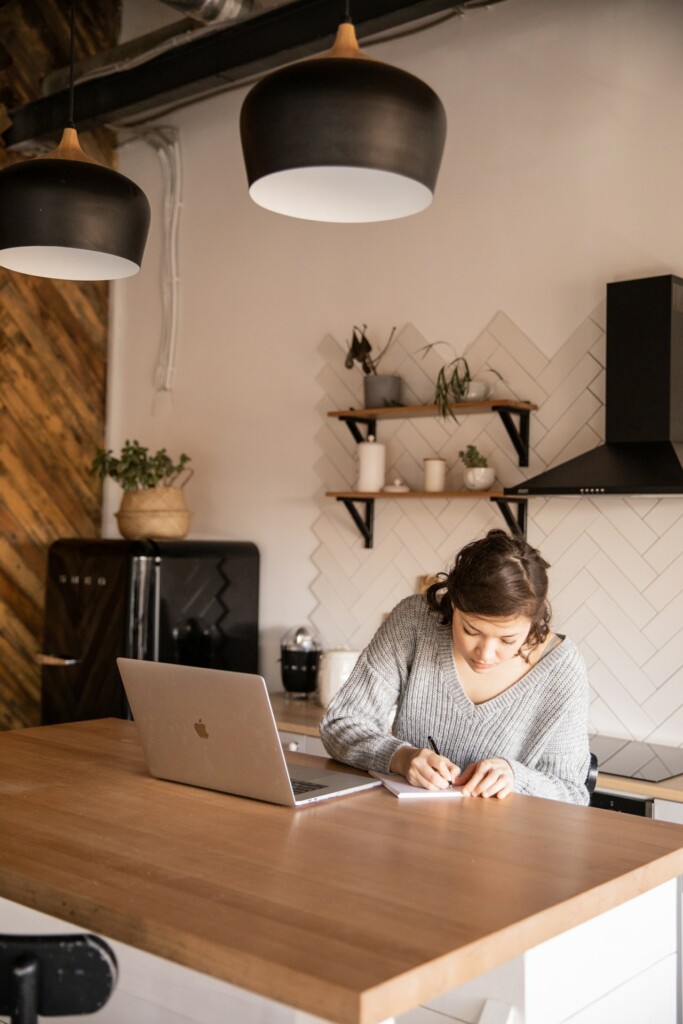 Woman in front of computer and writing notes. Couples therapy