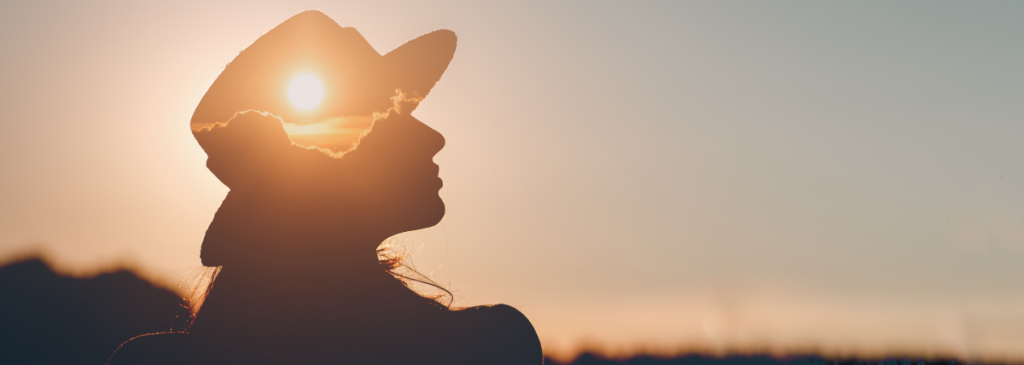 Silhouette of woman and sun 