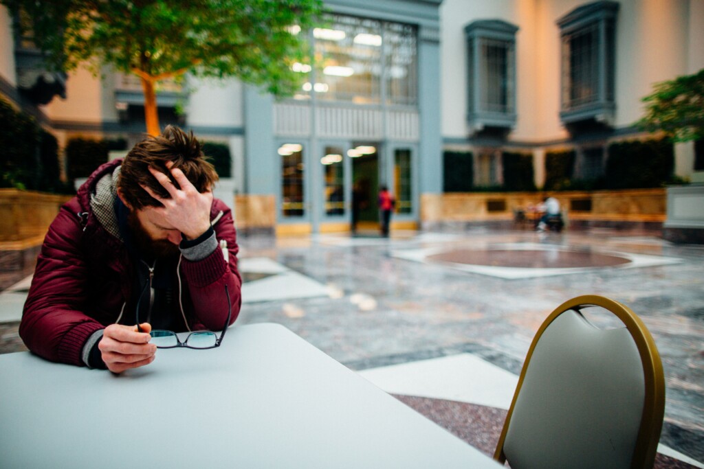 Young man feeling stressed and overwhelmed