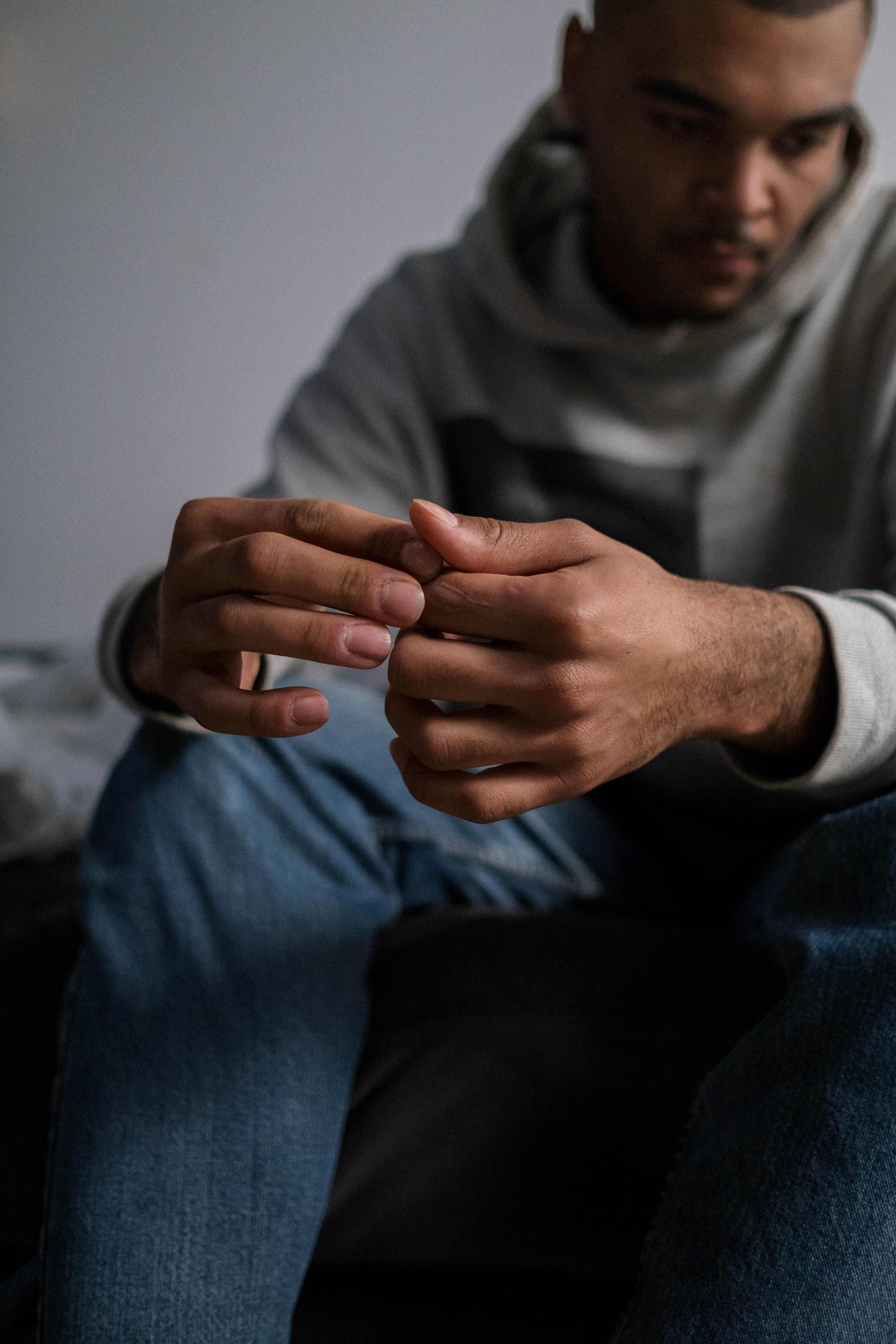 Man sitting down feeling anxious