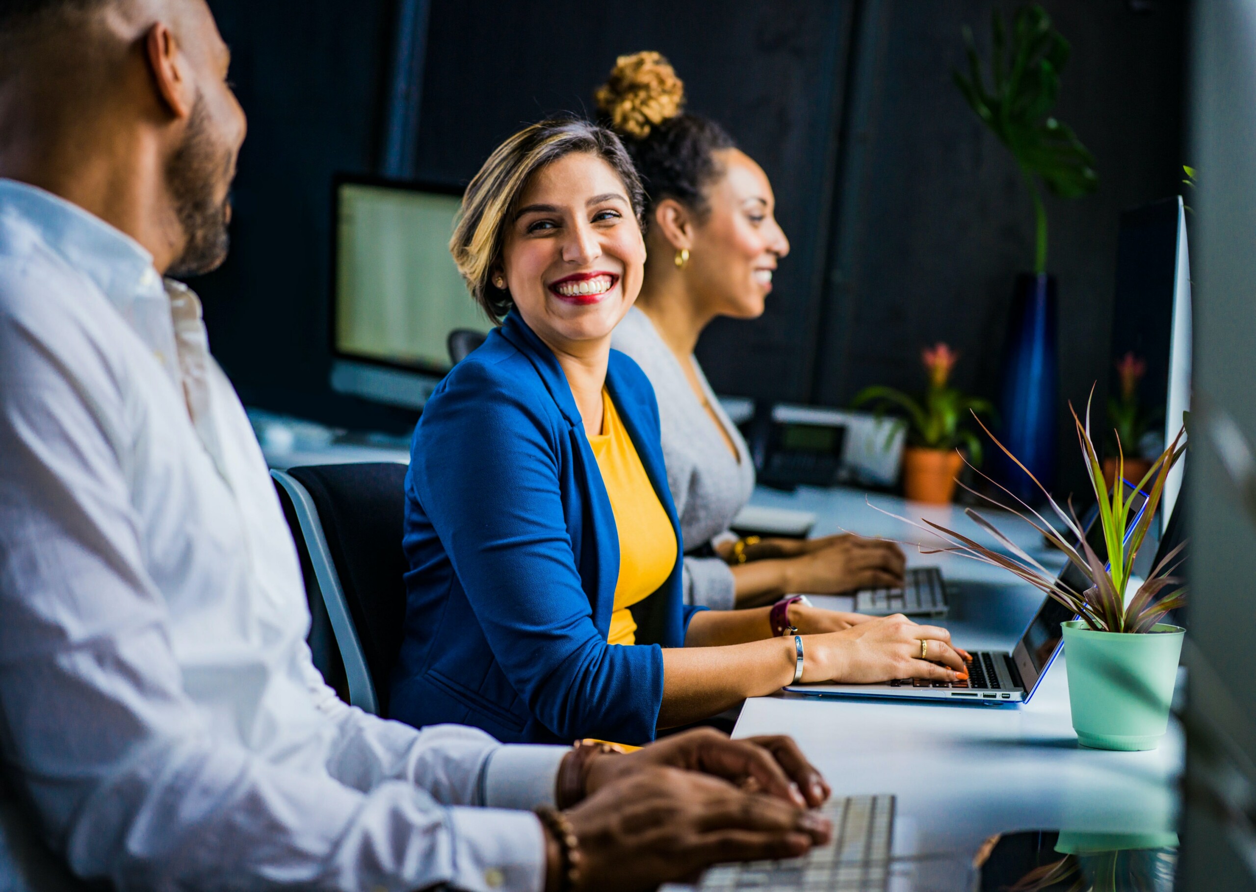 Office workers smiling at each other 